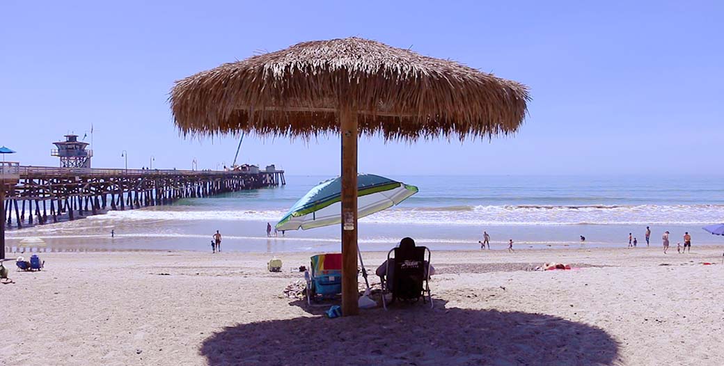Guest enjoying beach palapa in San Clemente